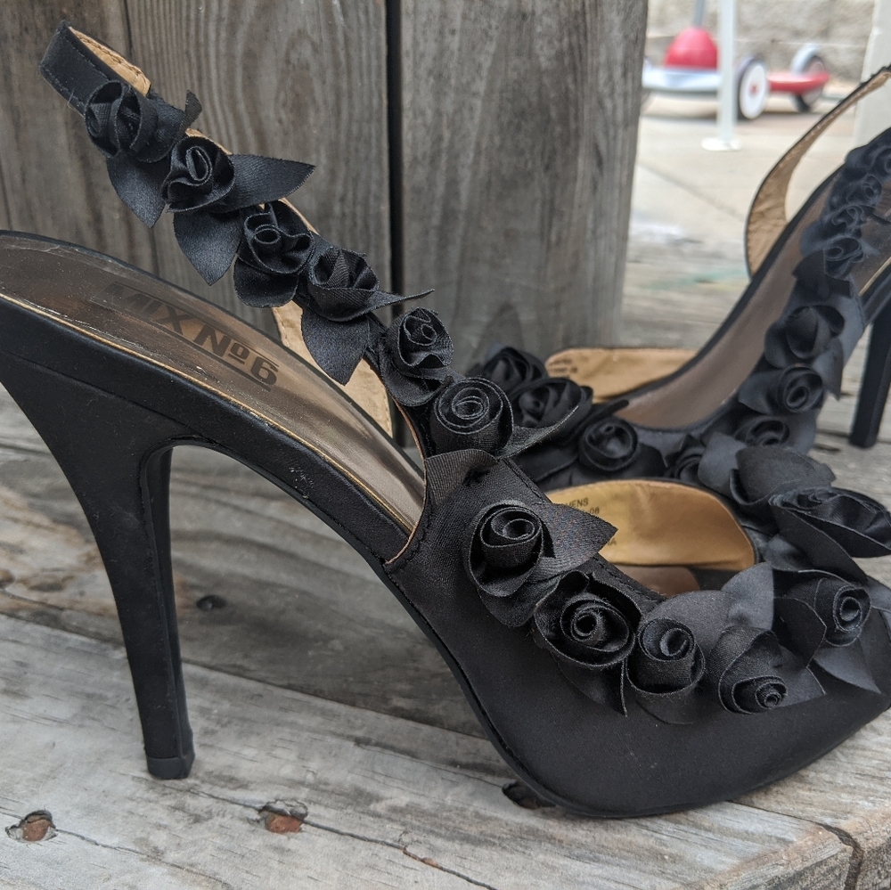 Black heels with flowers down the sides